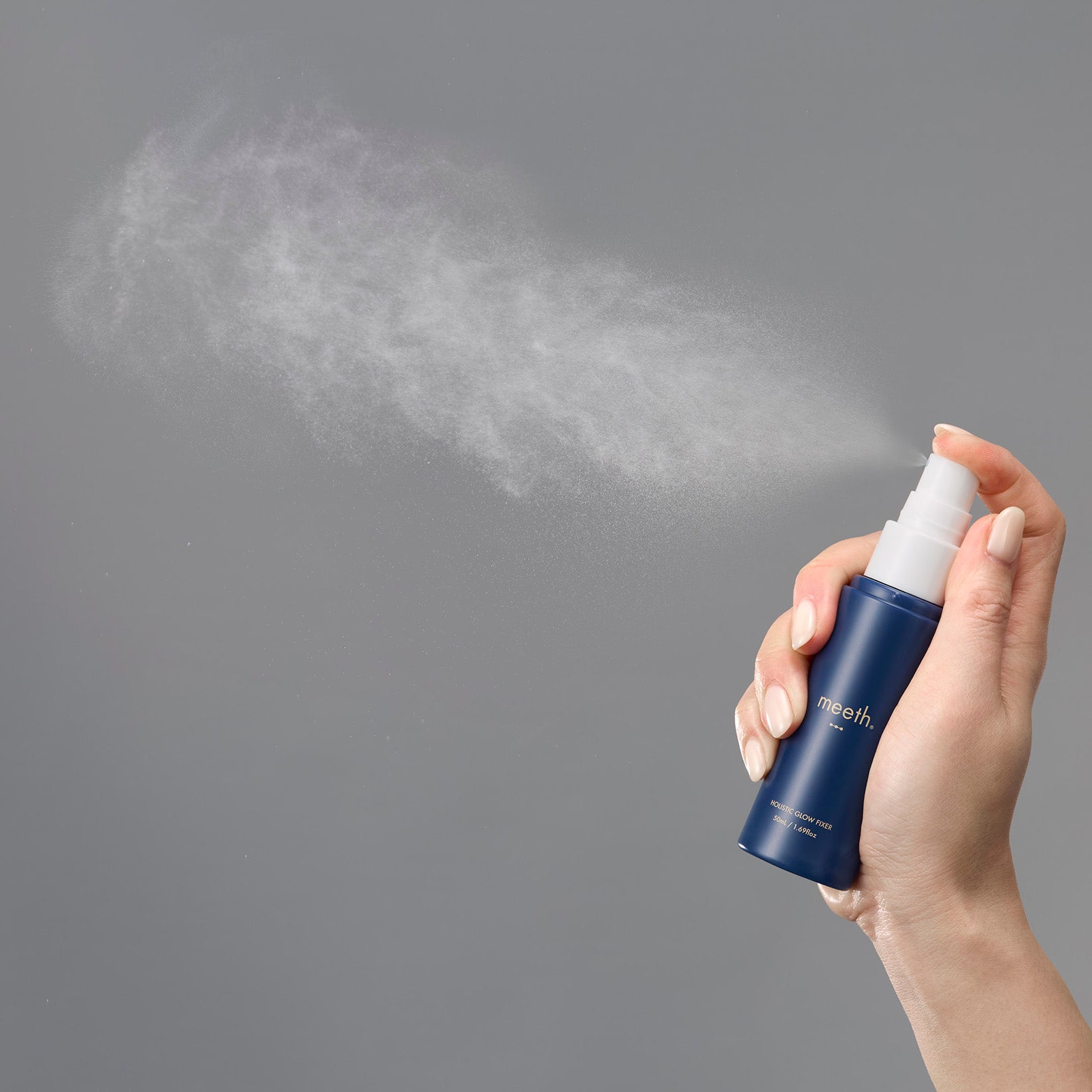 Meeth 3 Dot Holistic Glow Fixer mist spray in action